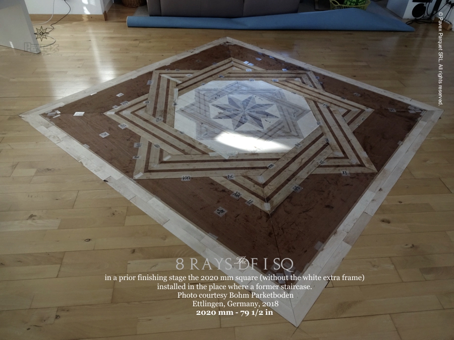 A large geometric hardwood floor medallion inlay
